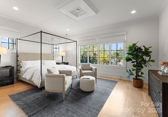 bedroom featuring hardwood / wood-style floors and ornamental molding