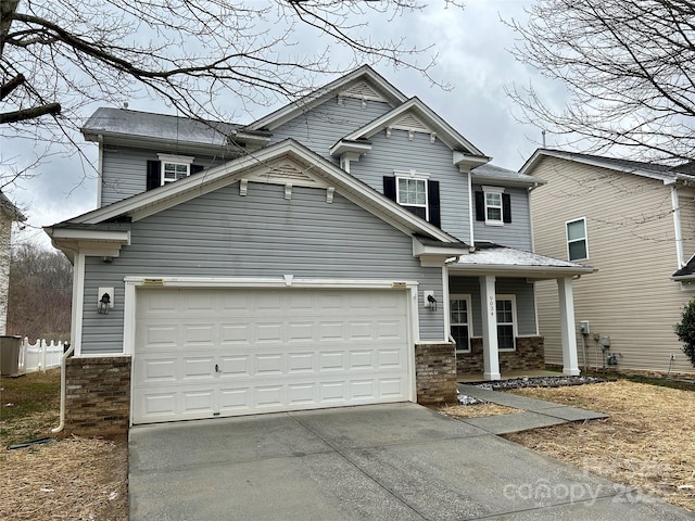 view of front of home featuring a garage, a porch, concrete driveway, and brick siding