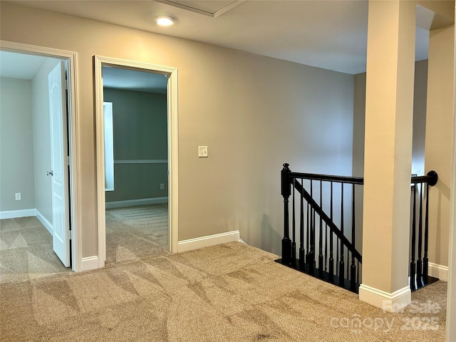 interior space featuring carpet floors and baseboards