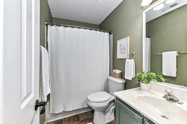 bathroom featuring a textured ceiling, toilet, and vanity