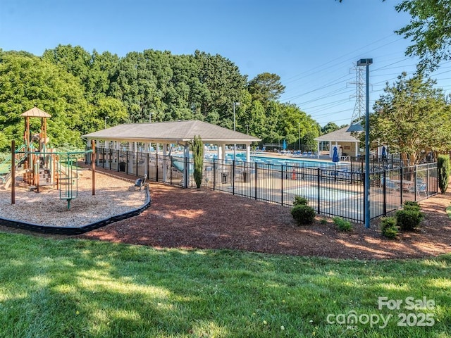 view of playground featuring a community pool