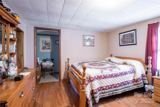 bedroom featuring hardwood / wood-style floors