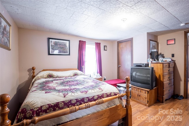 bedroom featuring light hardwood / wood-style flooring