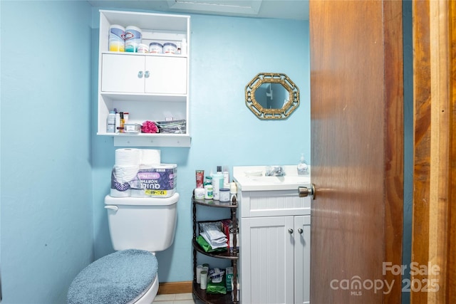 bathroom featuring toilet and vanity