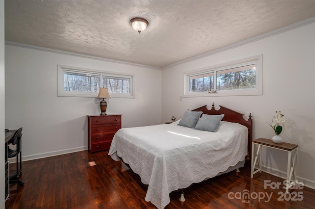 bedroom featuring dark hardwood / wood-style flooring, ornamental molding, and a textured ceiling