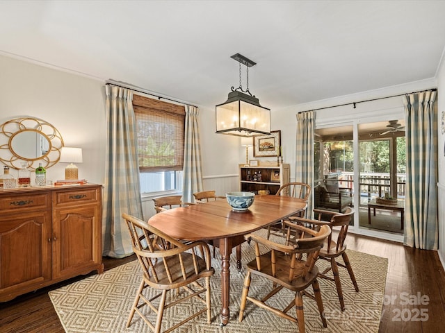 dining space featuring ceiling fan, dark hardwood / wood-style flooring, and ornamental molding