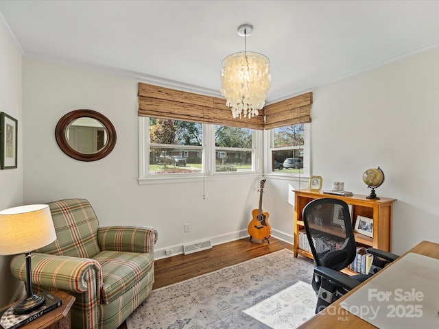 office area with ornamental molding, a chandelier, and hardwood / wood-style floors