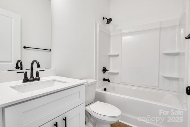 full bathroom with washtub / shower combination, vanity, and toilet