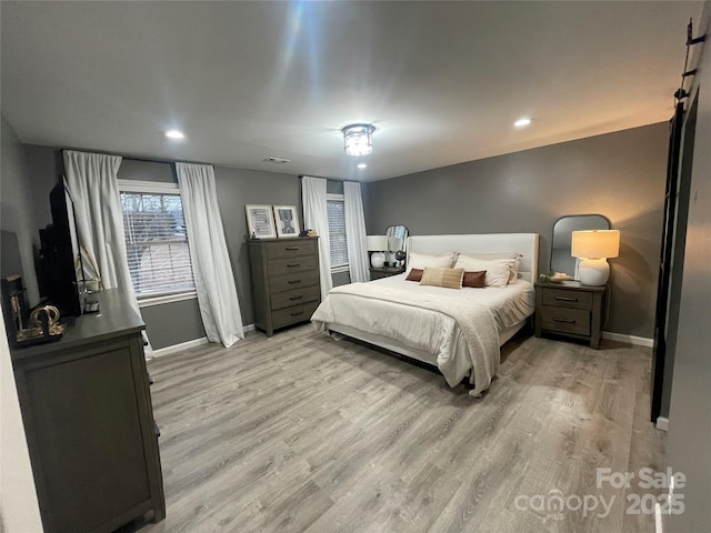 bedroom with light hardwood / wood-style flooring