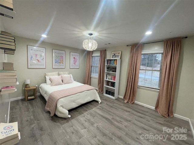 bedroom with hardwood / wood-style floors