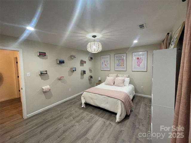 bedroom featuring wood-type flooring