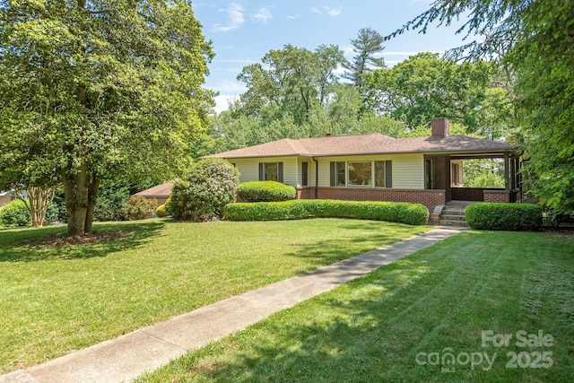 single story home featuring a front lawn