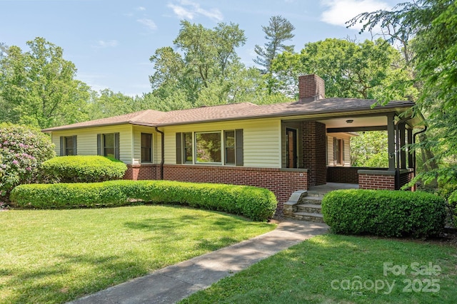 ranch-style house with a front lawn