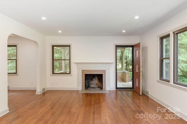 unfurnished living room with hardwood / wood-style floors