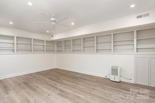 unfurnished room featuring light hardwood / wood-style flooring and ceiling fan