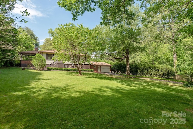 view of yard featuring a garage