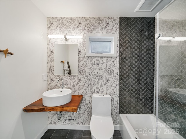 bathroom with sink, tile patterned floors, and toilet