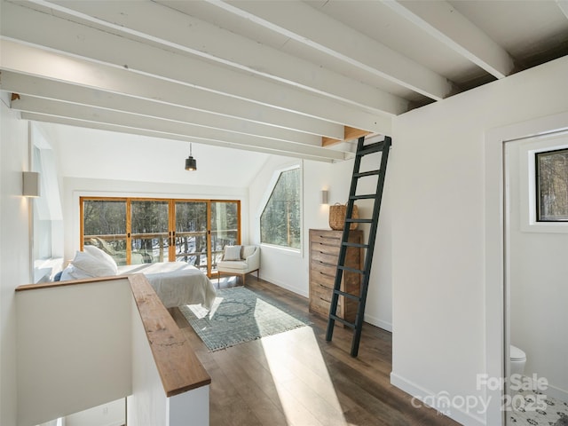 interior space with dark hardwood / wood-style floors and beamed ceiling