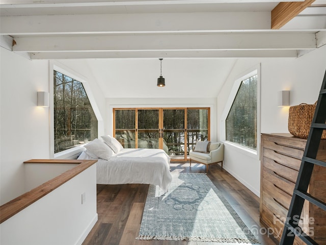 bedroom with lofted ceiling with beams, dark wood-type flooring, and multiple windows