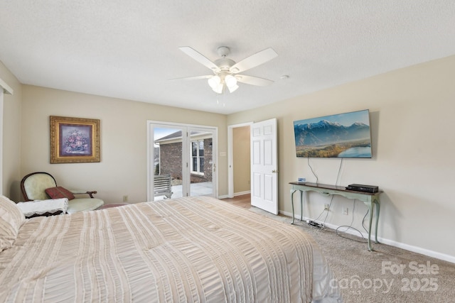 carpeted bedroom with access to exterior, a textured ceiling, and ceiling fan