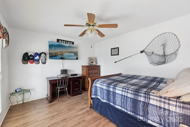 bedroom with ceiling fan and light hardwood / wood-style floors