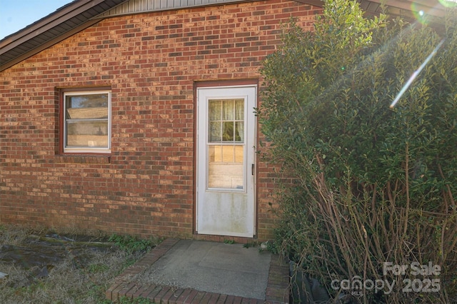 entrance to property with a patio area