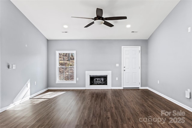 unfurnished living room with hardwood / wood-style floors and ceiling fan