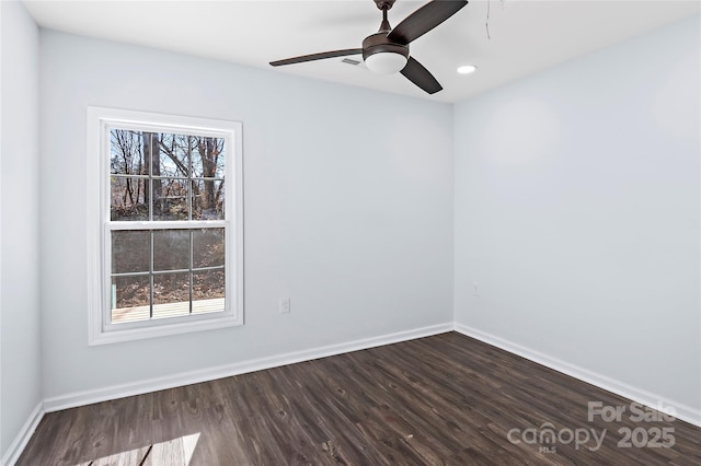 unfurnished room featuring hardwood / wood-style flooring, plenty of natural light, and ceiling fan