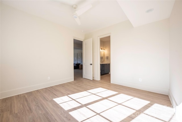 empty room with ceiling fan and hardwood / wood-style floors