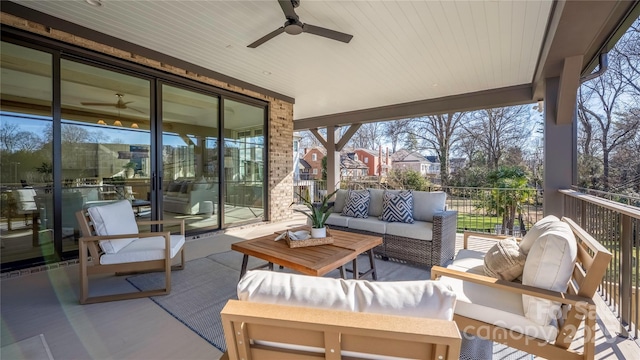 exterior space with an outdoor living space and ceiling fan