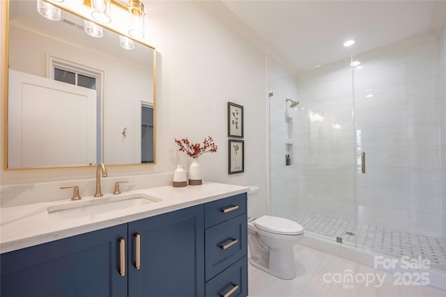 bathroom with vanity, tile patterned flooring, toilet, and walk in shower