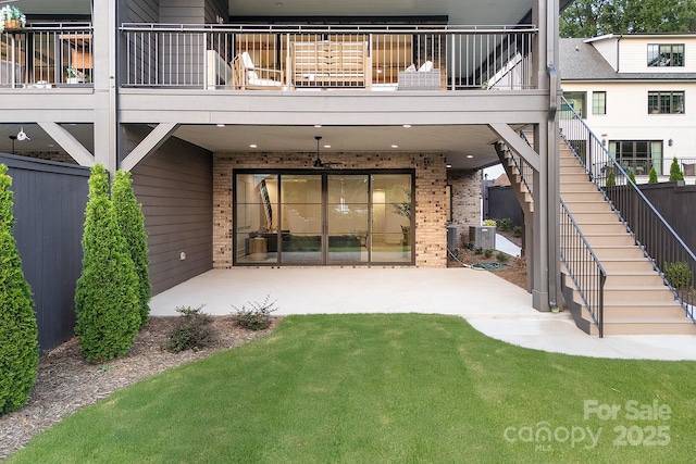 1214 S Kings Dr Unit A, Charlotte, NC 28207 - rear view of house with brick siding, stairway, a patio, and a lawn