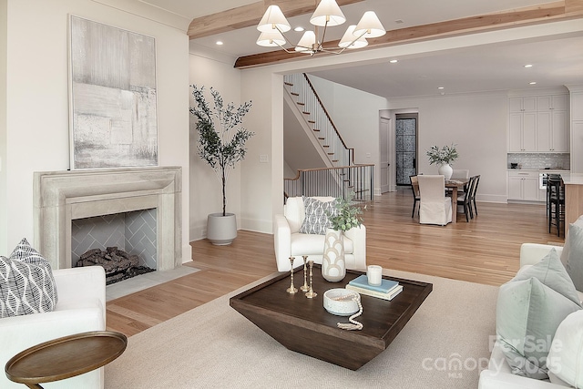 1214 S Kings Dr Unit A, Charlotte, NC 28207 - living area with light wood-style flooring, stairway, recessed lighting, a chandelier, and a high end fireplace