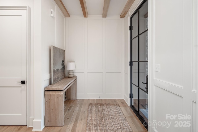 1214 S Kings Dr Unit A, Charlotte, NC 28207 - mudroom featuring a decorative wall, beamed ceiling, and light wood-style floors