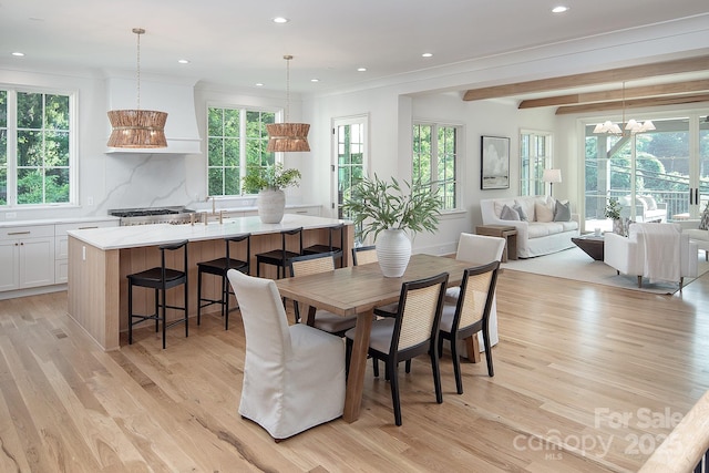 1214 S Kings Dr Unit A, Charlotte, NC 28207 - dining area with light wood-style floors, healthy amount of natural light, recessed lighting, a chandelier, and beamed ceiling