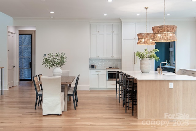 1214 S Kings Dr Unit A, Charlotte, NC 28207 - dining area featuring light wood-style flooring and recessed lighting