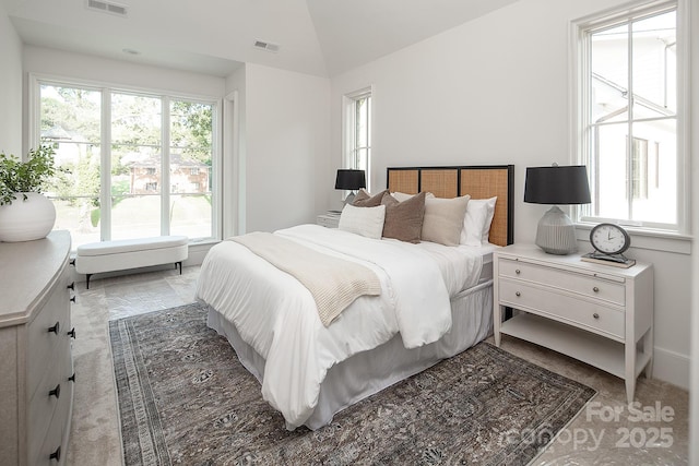 1214 S Kings Dr Unit A, Charlotte, NC 28207 - carpeted bedroom featuring vaulted ceiling