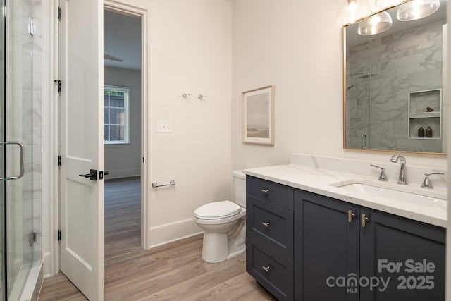 1214 S Kings Dr Unit A, Charlotte, NC 28207 - full bathroom featuring wood finished floors, vanity, and a stall shower