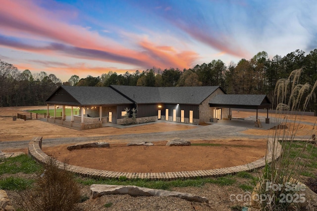 view of back house at dusk