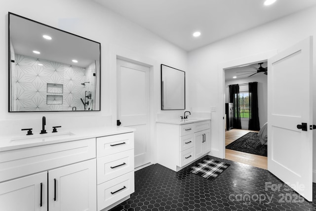 bathroom with vanity, a shower, and ceiling fan