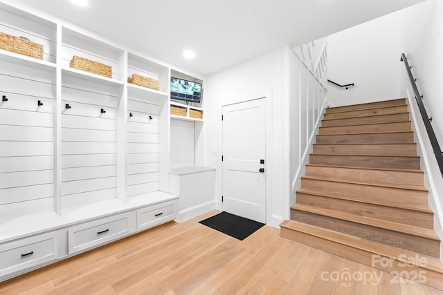 mudroom with light hardwood / wood-style floors