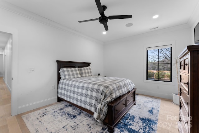 bedroom with ceiling fan, ornamental molding, and light wood-type flooring