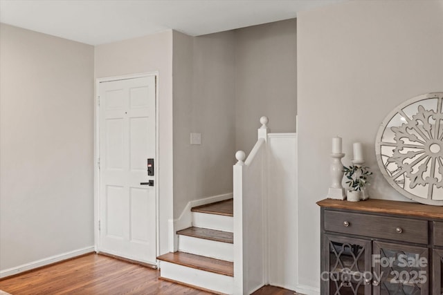 staircase featuring hardwood / wood-style flooring