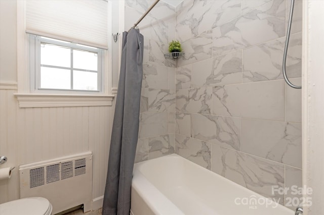 bathroom with toilet, radiator heating unit, and shower / bathtub combination with curtain