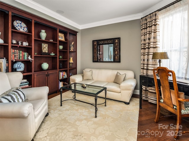 living room with light wood-type flooring and ornamental molding