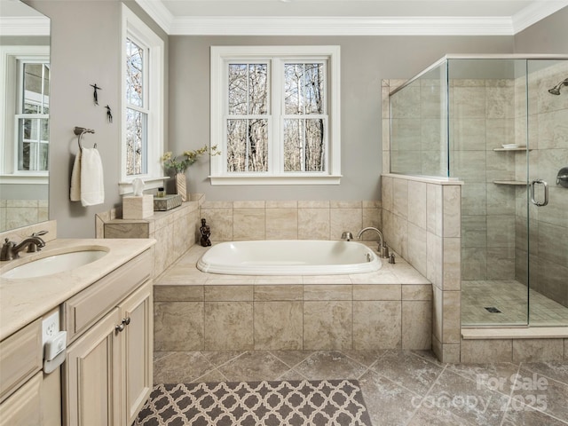 bathroom featuring a wealth of natural light, vanity, ornamental molding, and plus walk in shower