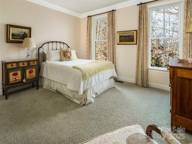 carpeted bedroom with ornamental molding and multiple windows