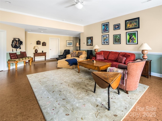 living room featuring ceiling fan and crown molding