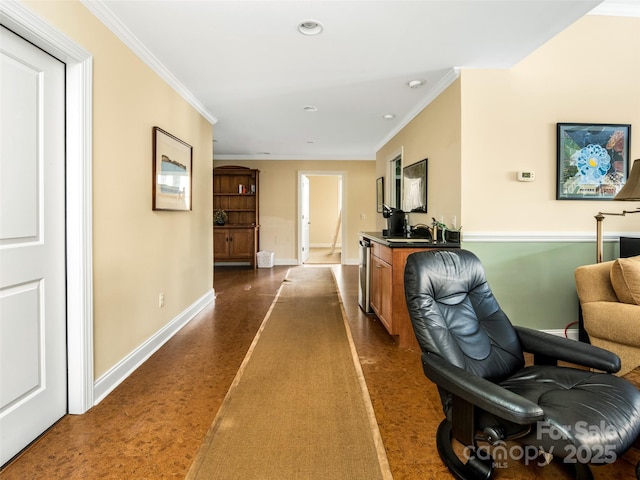 corridor with ornamental molding and sink