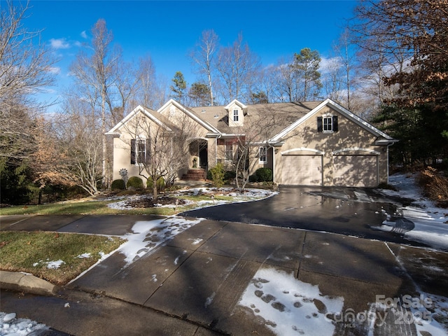 front facade with a garage